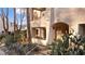 Condo exterior with desert landscaping and a private front entrance with a unit number above at 3843 Desert Marina Dr # 232, Laughlin, NV 89029