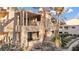 Exterior view of building with balconies, desert landscaping, and architectural details at 3843 Desert Marina Dr # 232, Laughlin, NV 89029