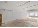 Empty garage with hooks, shelving and a door leading outside at 3843 Desert Marina Dr # 232, Laughlin, NV 89029
