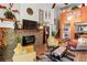 Spacious living room with wood floors, comfortable seating, and a cozy fireplace at 3843 Desert Marina Dr # 232, Laughlin, NV 89029