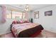 Well-lit bedroom featuring a comfortable bed with decorative pillows and a window view at 3843 Desert Marina Dr # 232, Laughlin, NV 89029