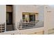 Outdoor patio with neutral stucco exterior, metal railings, and patio furniture at 3843 Desert Marina Dr # 232, Laughlin, NV 89029