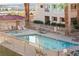 Community pool and spa with lounge chairs surrounded by well-maintained grounds at 3843 Desert Marina Dr # 232, Laughlin, NV 89029