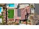Top-down aerial perspective of a home featuring solar panels, green lawn, swimming pool, and landscaping at 4108 Freel Peak Ct, Las Vegas, NV 89129