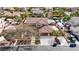 Aerial view of a well-maintained home with a red tile roof, landscaped yard, and spacious driveway at 4108 Freel Peak Ct, Las Vegas, NV 89129