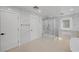 Modern bathroom with a glass shower, marble walls, and sleek white fixtures at 4108 Freel Peak Ct, Las Vegas, NV 89129