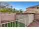 Dog run in backyard with grass and gravel area with fencing at 4108 Freel Peak Ct, Las Vegas, NV 89129