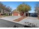 Charming single-Gathering home with a spacious driveway, mature trees, and well-manicured landscaping at 4108 Freel Peak Ct, Las Vegas, NV 89129