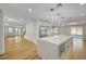 Open kitchen featuring a large center island and views of living area and backyard at 4108 Freel Peak Ct, Las Vegas, NV 89129