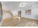 Open-concept living room with lots of natural light, modern flooring and a staircase to the second floor at 4108 Freel Peak Ct, Las Vegas, NV 89129