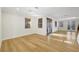 Open-concept living room features hardwood floors and large windows at 4108 Freel Peak Ct, Las Vegas, NV 89129
