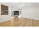Bright living area with modern finishes, including hardwood floors and white walls at 4108 Freel Peak Ct, Las Vegas, NV 89129