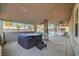 Covered patio featuring a hot tub, ceiling fans, and views of the backyard at 4108 Freel Peak Ct, Las Vegas, NV 89129