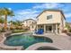 Backyard featuring a pool, patio with grill and outdoor furniture, and manicured landscaping at 4247 Jordanville St, Las Vegas, NV 89129