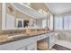 Elegant bathroom featuring dual sinks, granite countertops, and a separate shower and tub at 4247 Jordanville St, Las Vegas, NV 89129