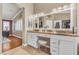 Primary bathroom featuring double sinks, granite counters, a walk in closet and an open design at 4247 Jordanville St, Las Vegas, NV 89129