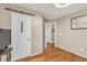 This bedroom features hardwood floors, neutral paint, and an adjoining hallway at 4247 Jordanville St, Las Vegas, NV 89129