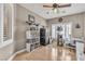 Inviting bedroom with ample natural light, tile floor, shelving, and a ceiling fan at 4247 Jordanville St, Las Vegas, NV 89129