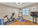 Exercise room with hardwood floors, a ceiling fan, and work-out equipment at 4247 Jordanville St, Las Vegas, NV 89129
