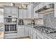 Updated kitchen featuring stainless steel appliances, granite countertops, and modern cabinetry at 4247 Jordanville St, Las Vegas, NV 89129