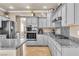 Stylish kitchen with updated appliances, granite counters, and ample storage space at 4247 Jordanville St, Las Vegas, NV 89129