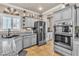 Beautiful kitchen featuring grey cabinets, stainless steel appliances, granite countertops and tile flooring at 4247 Jordanville St, Las Vegas, NV 89129