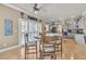 Open dining area and kitchen featuring modern cabinets, granite countertops, and a neutral color scheme at 4247 Jordanville St, Las Vegas, NV 89129