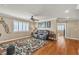 This living room features hardwood floors, neutral paint, and a ceiling fan at 4247 Jordanville St, Las Vegas, NV 89129