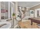 Cozy room featuring a table, bar stools, plantation shutters, and travertine floors at 4247 Jordanville St, Las Vegas, NV 89129