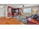 Cozy living room with a decorative rug, entertainment center, and comfortable seating at 4247 Jordanville St, Las Vegas, NV 89129