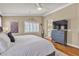 Comfortable main bedroom featuring hardwood floors, neutral tones, and an en-suite bathroom at 4247 Jordanville St, Las Vegas, NV 89129