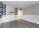 Spacious bedroom with grey wood-look flooring, neutral walls and unique dark floral accents at 4316 W Lake Mead Blvd # 202, Las Vegas, NV 89108