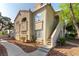 Charming condo exterior with stucco siding, terra cotta roof, and inviting front entrance with landscaped walkway at 4316 W Lake Mead Blvd # 202, Las Vegas, NV 89108
