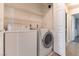 Convenient laundry room with washer, dryer, and shelving provides storage and functionality at 4316 W Lake Mead Blvd # 202, Las Vegas, NV 89108