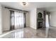 Bright living room features tile floors, modern lighting, fireplace, and light window treatments at 4316 W Lake Mead Blvd # 202, Las Vegas, NV 89108