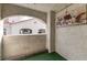 Small outdoor patio space with low turf floor and white stucco walls at 4316 W Lake Mead Blvd # 202, Las Vegas, NV 89108