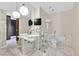 Modern bathroom with marble tile, dual sinks, large mirror, and a separate toilet at 4381 W Flamingo Rd # 1609, Las Vegas, NV 89103