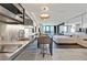This condo features a modern stainless steel kitchen with a breakfast bar that opens to the living and bedroom at 4381 W Flamingo Rd # 1609, Las Vegas, NV 89103