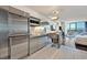 This condo features a modern kitchen with stainless steel appliances, a breakfast bar and open living space at 4381 W Flamingo Rd # 1609, Las Vegas, NV 89103