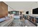 The modern living space features a lounge area with queen size bed, wood floors and mirrored walls to maximize space at 4381 W Flamingo Rd # 1609, Las Vegas, NV 89103