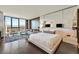 This condo's main bedroom features gorgeous city views, wood floors, and a seating area to enjoy the vistas at 4381 W Flamingo Rd # 1609, Las Vegas, NV 89103