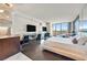 The condo's open living space includes a desk and entertainment area, city views, and a queen size bed at 4381 W Flamingo Rd # 1609, Las Vegas, NV 89103