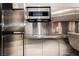 Sleek modern kitchen featuring stainless steel appliances and minimalistic design at 4381 W Flamingo Rd # 1809, Las Vegas, NV 89103