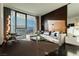 Bright living room with a comfortable sectional sofa, floor-to-ceiling windows, and stunning city views at 4381 W Flamingo Rd # 1809, Las Vegas, NV 89103
