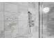 Elegant shower featuring luxurious marble tiling and modern fixtures creating a spa-like retreat at 4381 W Flamingo Rd # 1809, Las Vegas, NV 89103