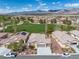 A stunning aerial view showcases the home's prime location near a golf course, complemented by mountain views at 5224 E San Palo Dr, Pahrump, NV 89061