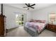 Comfortable bedroom with sliding glass doors offering backyard access and natural light at 5224 E San Palo Dr, Pahrump, NV 89061