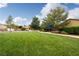 A large common area features a large lawn, walkway, shade covering, and bench at 5224 E San Palo Dr, Pahrump, NV 89061