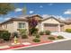 Attractive single-story house showcasing desert landscaping, stone details, and a functional three-car garage at 5224 E San Palo Dr, Pahrump, NV 89061