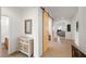Bright entryway featuring a decorative cabinet, mirror, tile floors, and barn door accent at 5224 E San Palo Dr, Pahrump, NV 89061